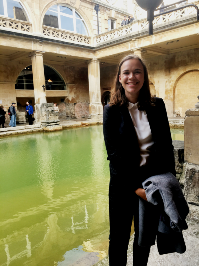 Mayze Teitler posing in front of a fountain during study abroad.