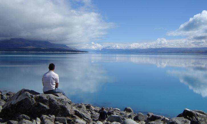 boy watching the peaceful ocean