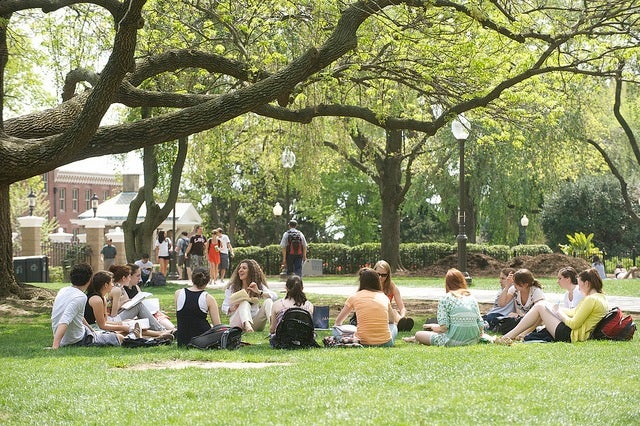 Students sitting on Georgetown's front lawn