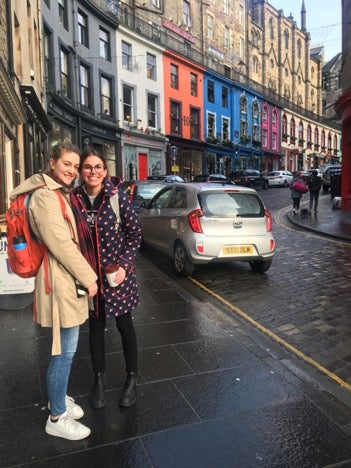 Lilia and another student on a sidewalk in St. Andrews, Scotland.