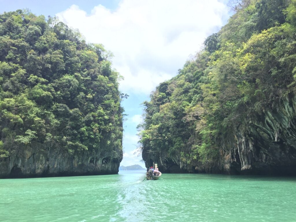 Boat between two small islands in a bay