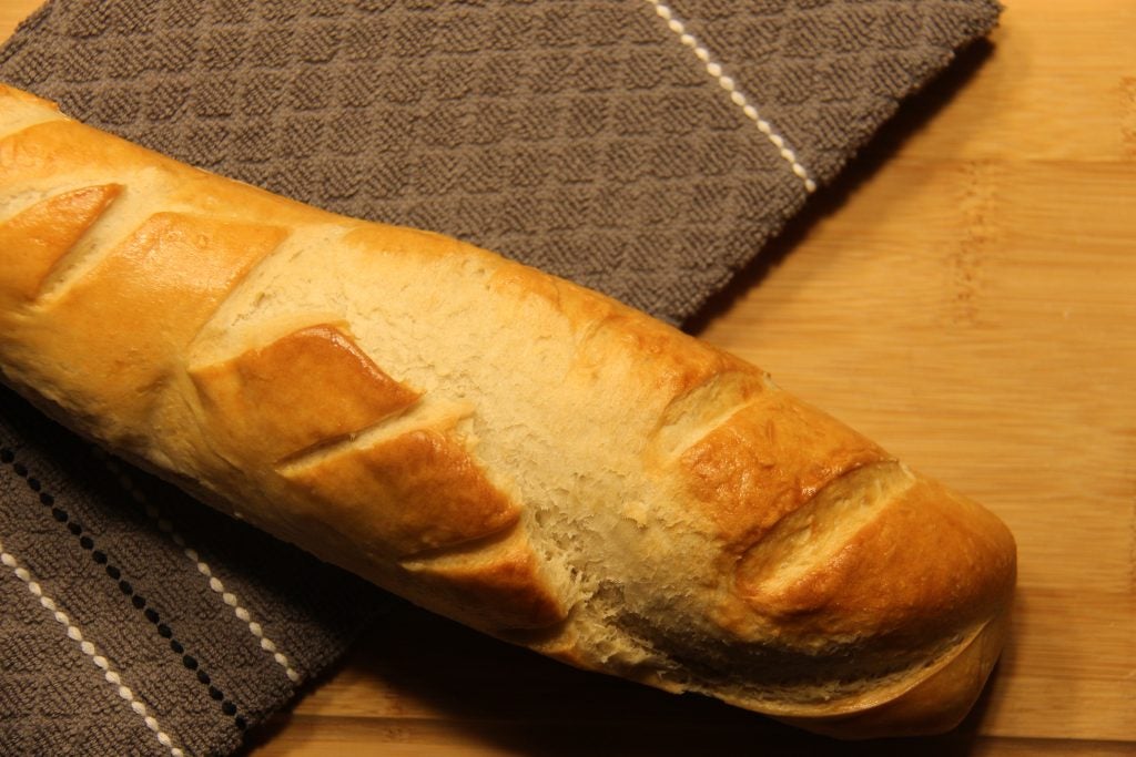 French bread placed on a wooden board.