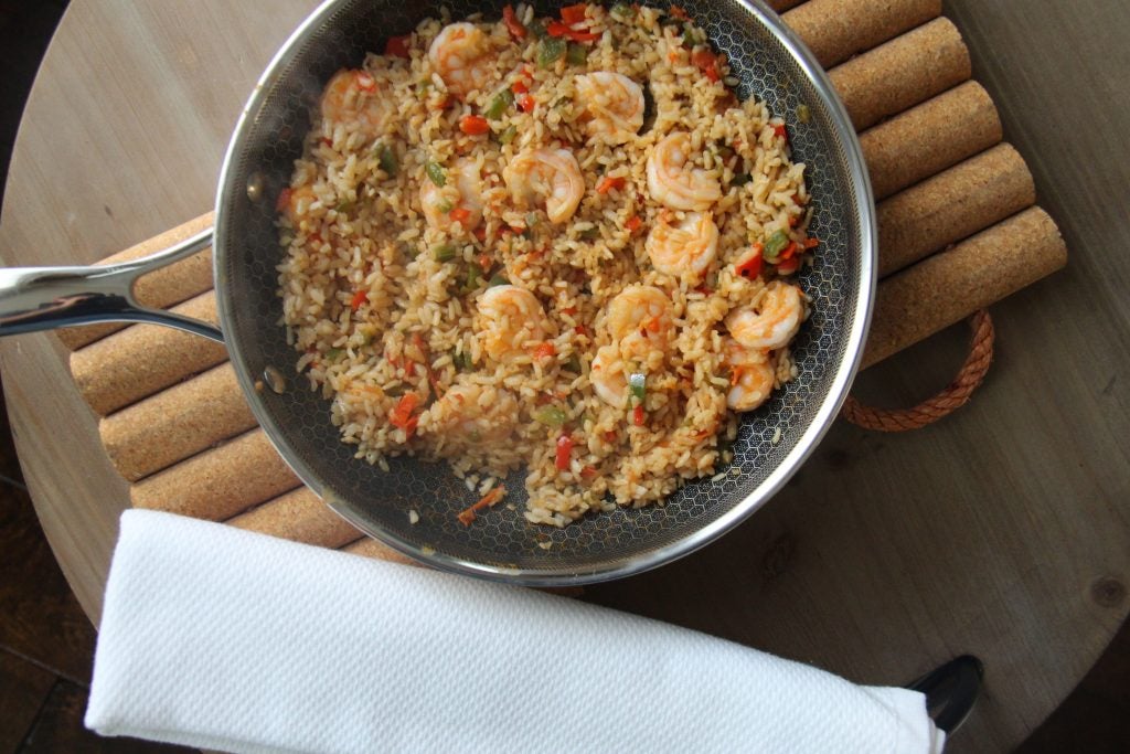 A sizzling pan of seafood spanish paella.