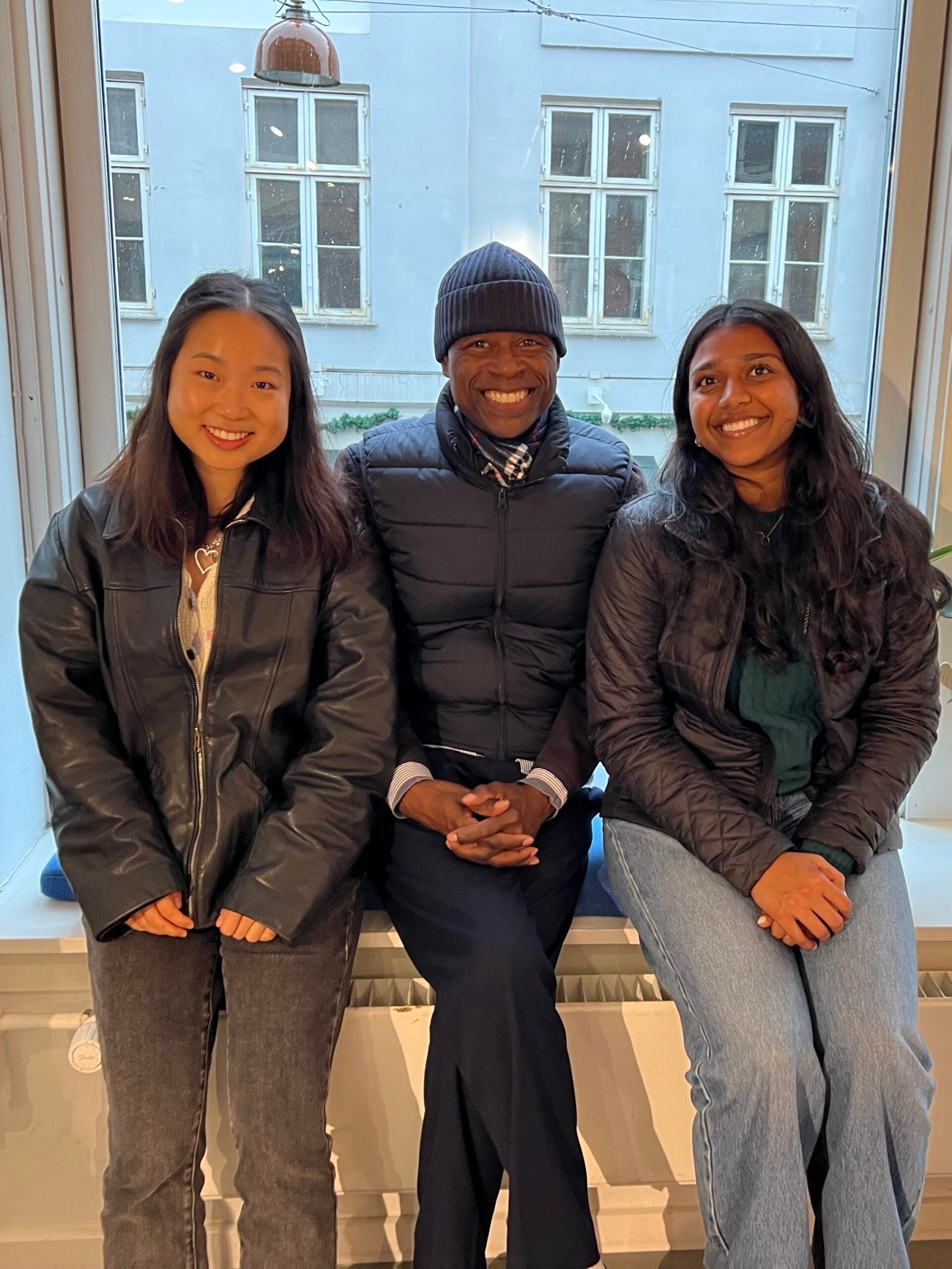 Dean Floyd sits in between two Georgetown students.